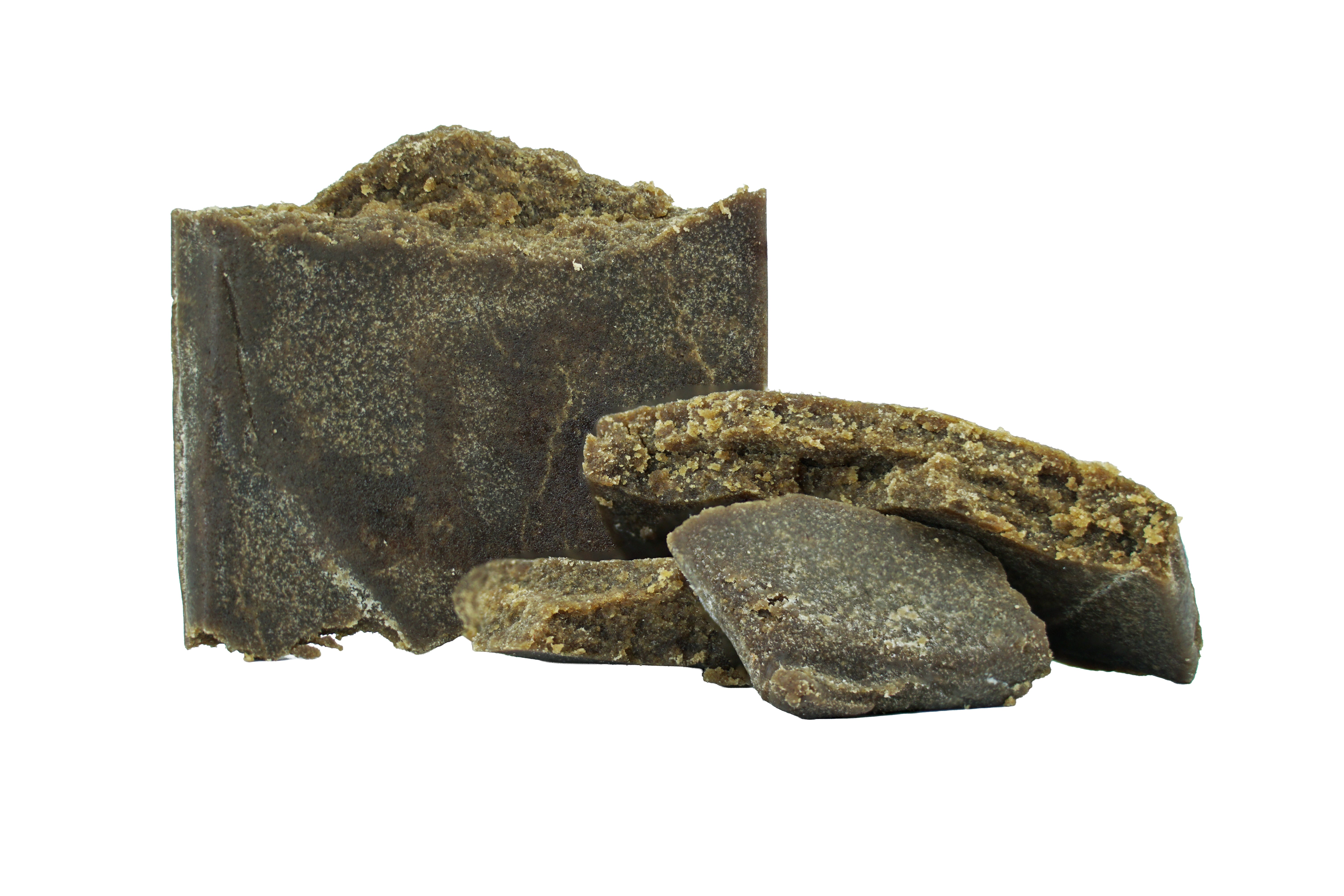 Several dark brown, crumbly chunks of GMO THCa Static Bubble Hash by Roz From Frasier are displayed on a white background, highlighting the premium quality often found in Oregon’s cannabis market.