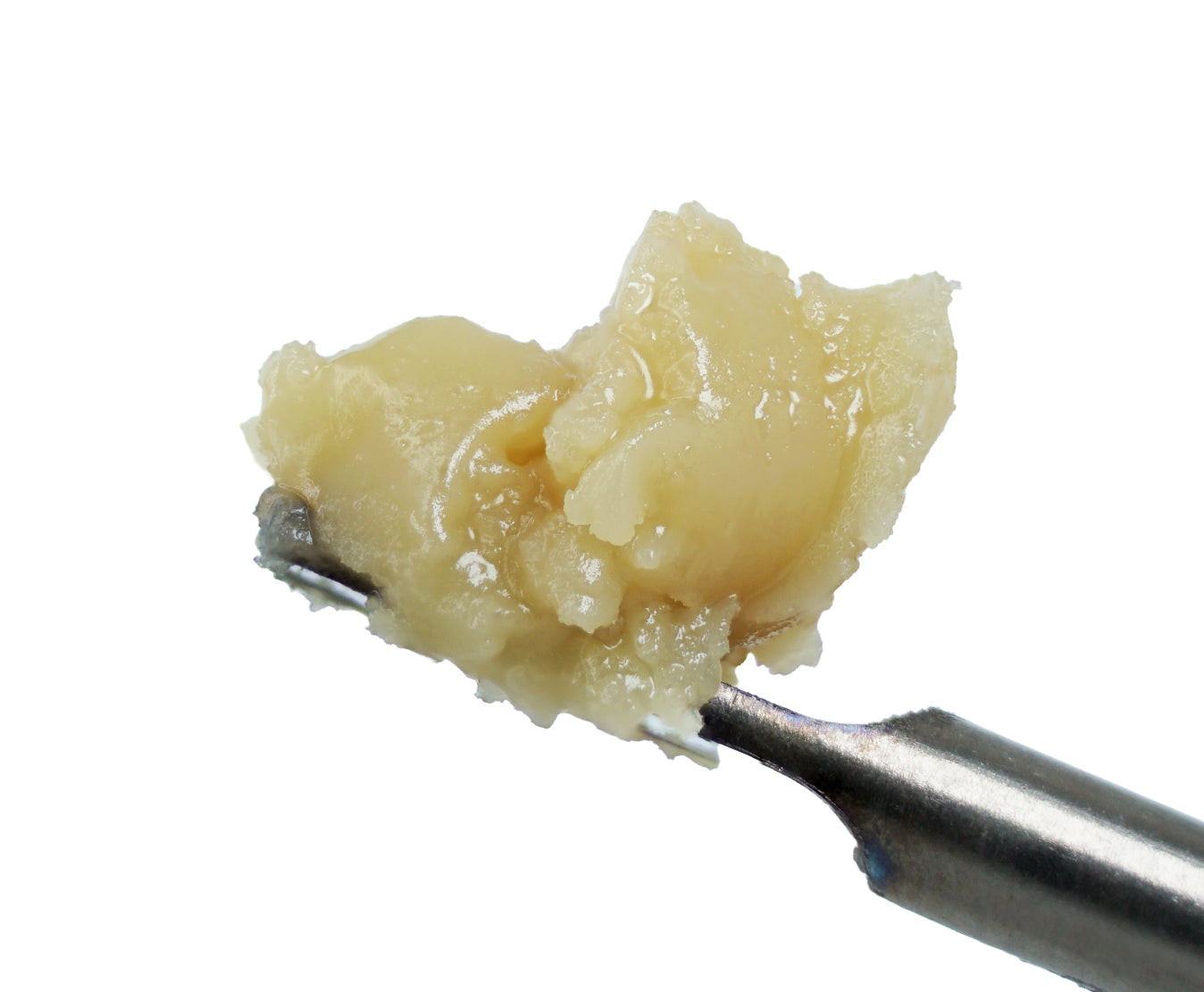 A close-up of a metal spatula holding a dollop of thick, beige-colored Candied Orangez 90u THCa Hash Rosin by roz from frasier against a white background, featuring creamy hues reminiscent of rare strains and subtle sweet orange flavors.