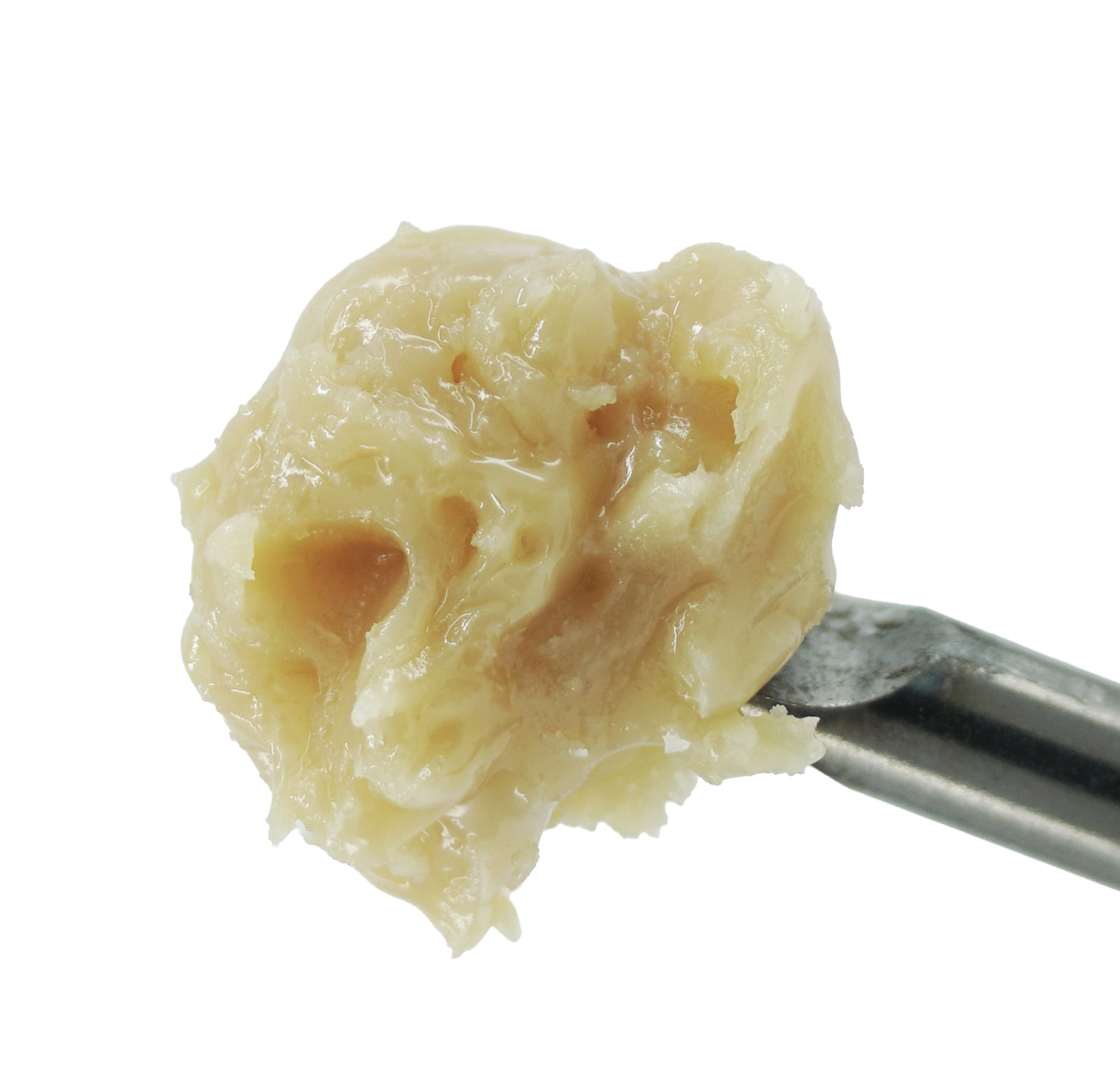 A close-up of a metal utensil holding creamy, slightly textured Mystery Baller Jar (1oz) THCa Hash Rosin by roz from frasier against a white background—ideal for cannabis enthusiasts seeking premium quality at a discounted price.