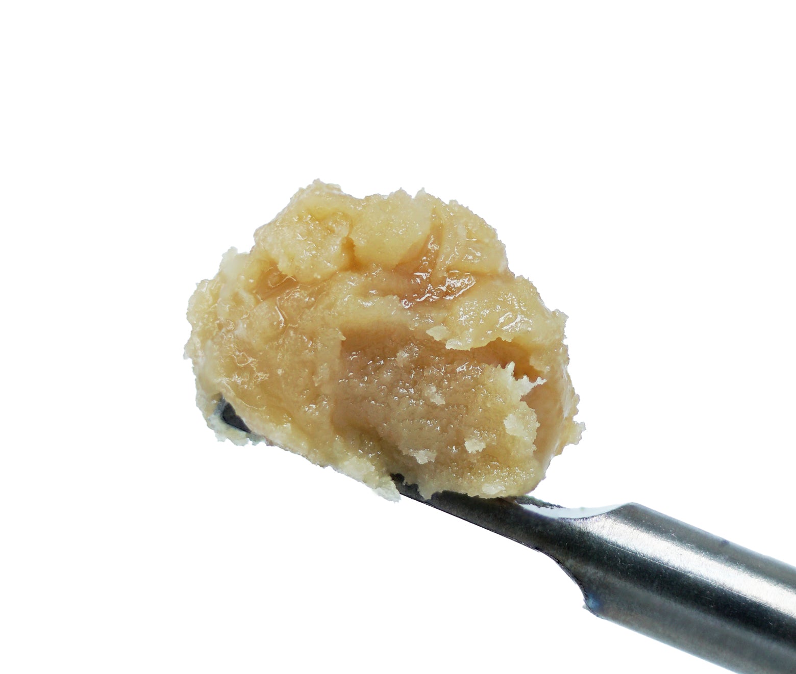 A close-up of a metal tool holding a small dollop of light brown, sticky Grape Overload THCa Hash Rosin by roz from frasier—reminiscent of grape cotton candy—against a white background.